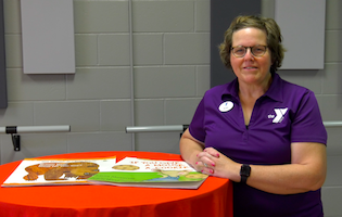 ymca staff with books for kids