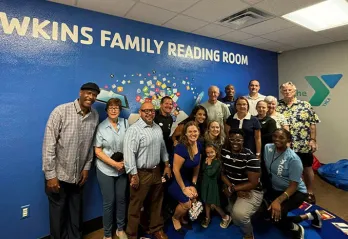 Carl and Cynthia Hawkins (middle) at the ribbon-cutting event with Bob Sierra Y staff and board members