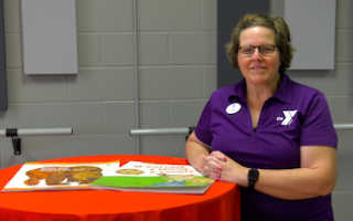 ymca staff with books for kids