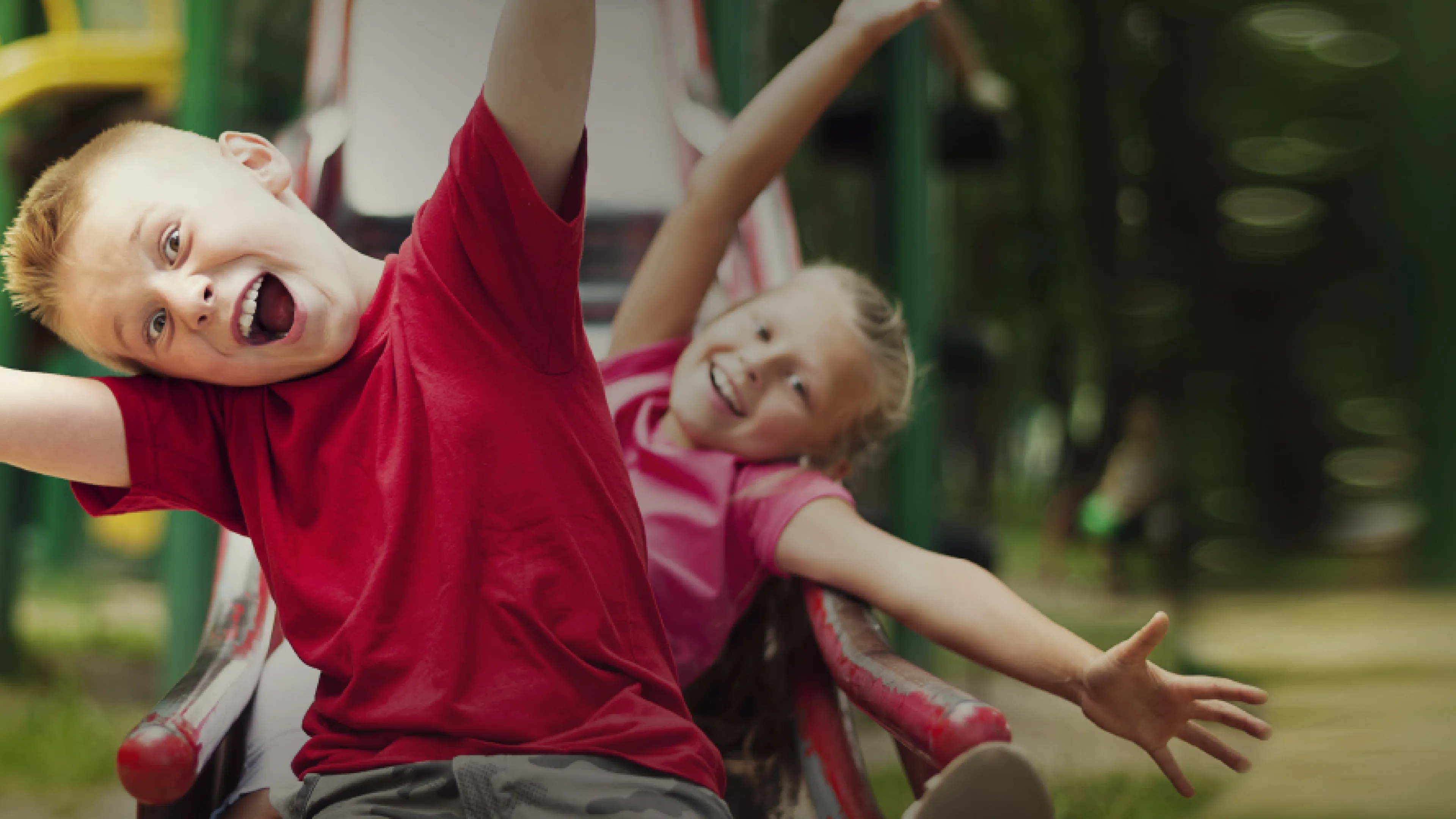 Kids sliding down slide