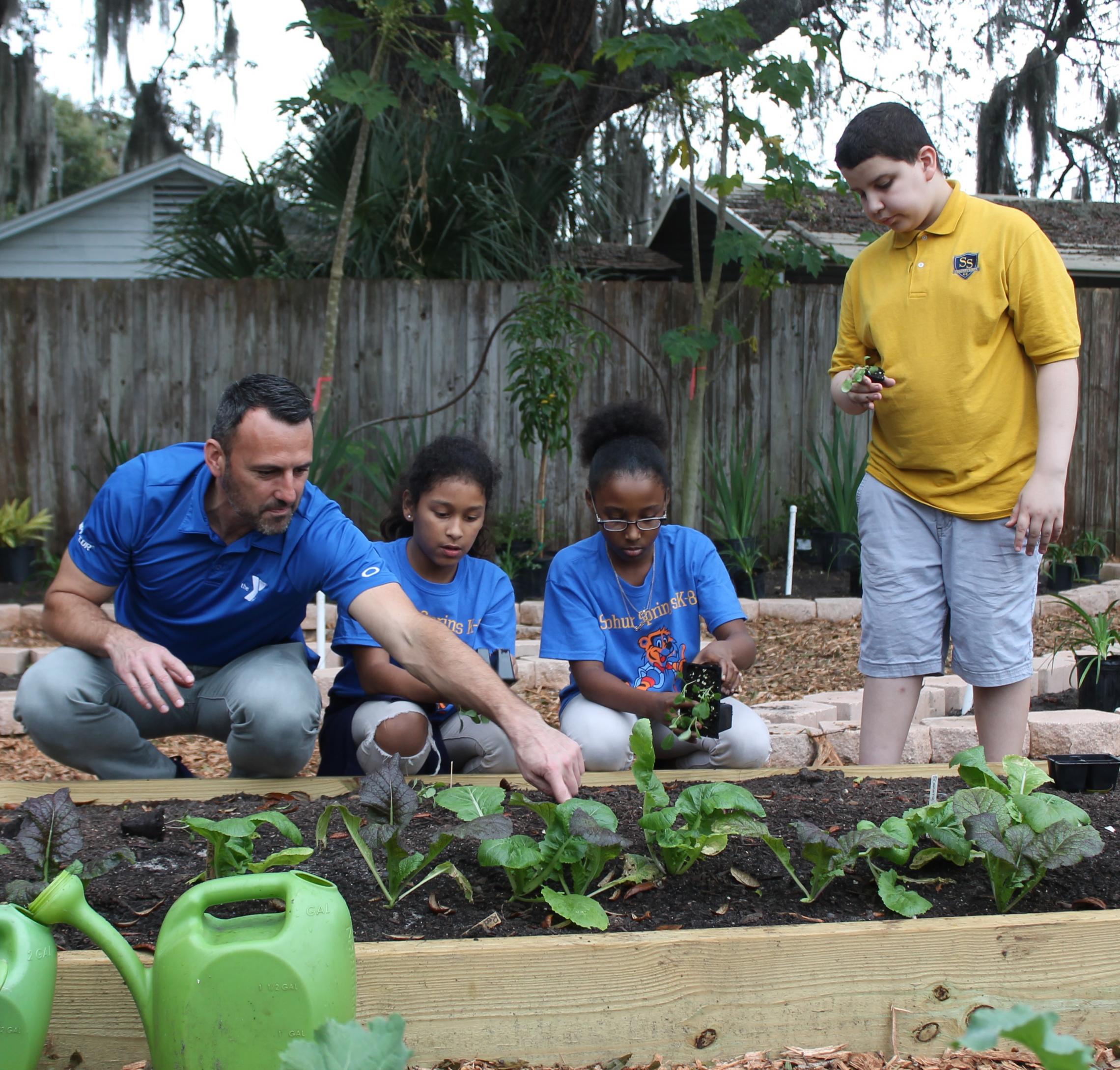 Matt with SS kids in garden