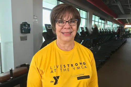 female graduate smiling after graduating LIVESTRONG at the YMCA