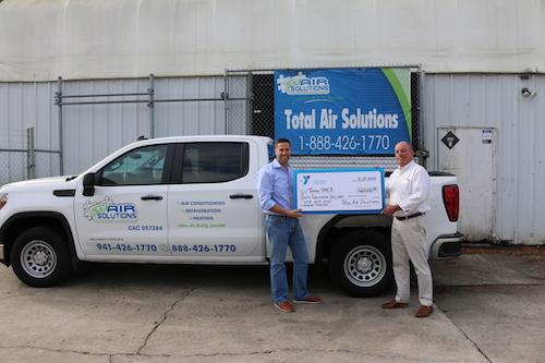 Total Air Solutions presents check to Tampa YMCA.
