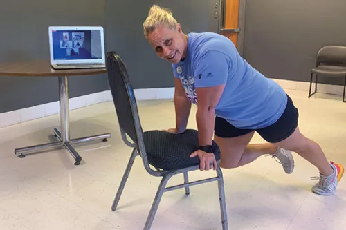 woman exercising with chair