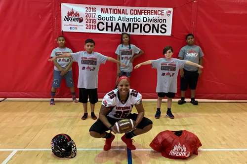 Tampa Bay Inferno Wide Receiver Dominique Jacobs with Y kids