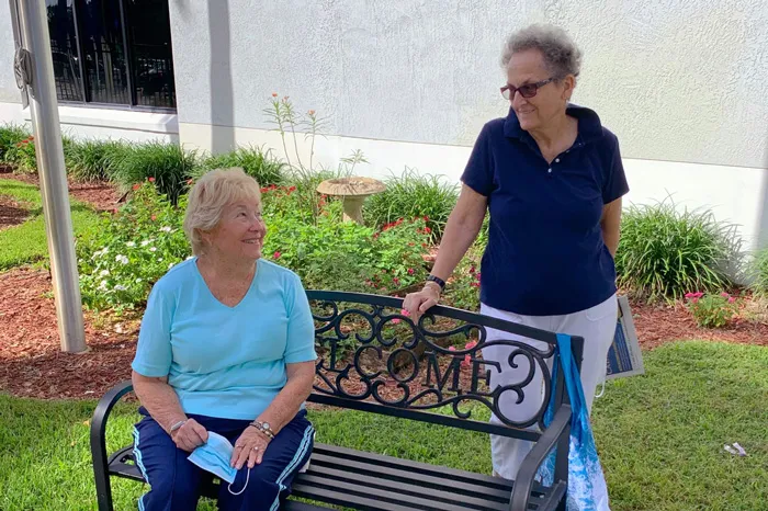 two ladies in ymca courtyard