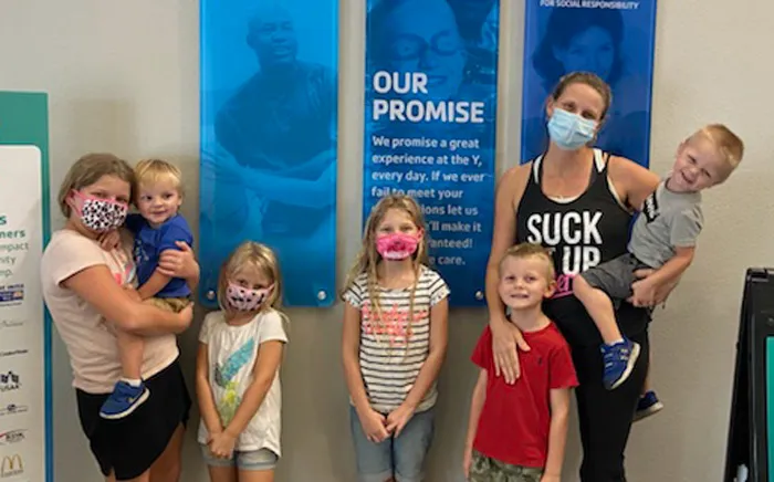 Mom with six children wearing face coverings at the Y 