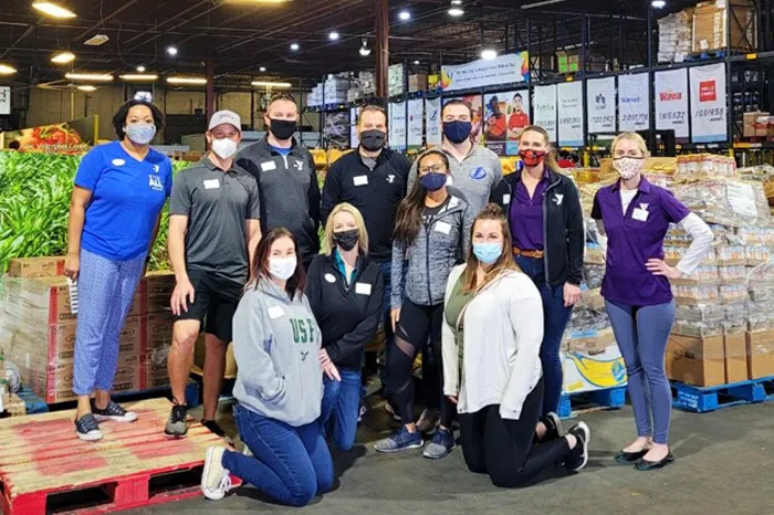 group of tampa ymca staff wearing masks while volunteering