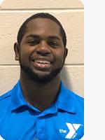 headshot male trainer wearing blue YMCA polo beige background
