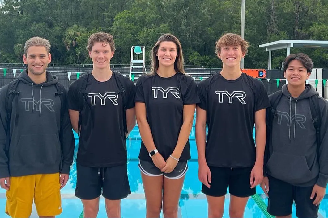 Five TYS swimmers pose after a big win