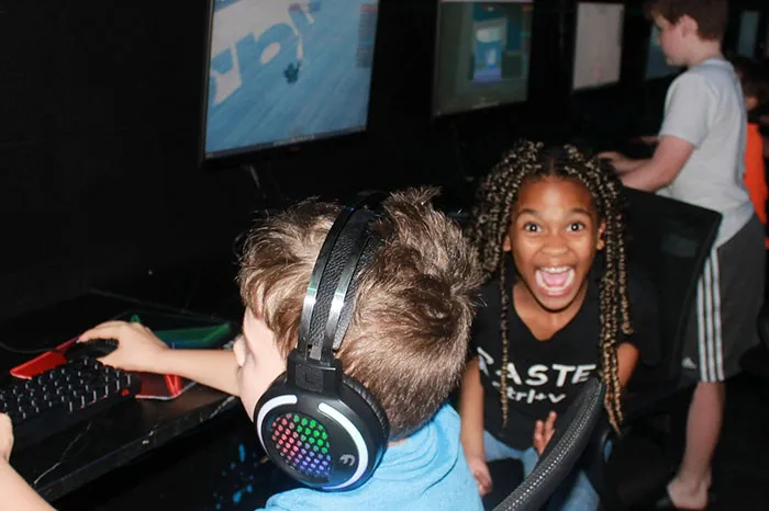 Children enjoy our coding program in the computer room at the North Brandon YMCA.