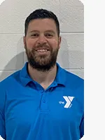 Headshot of man in blue polo with white YMCA logo.