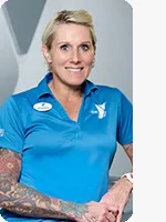 Woman wearing a light blue polo with white YMCA logo poses for a headshot